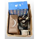 A box containing fishing reels, bait box, hip flask, fisherman's multi-draw storage chest, etc.