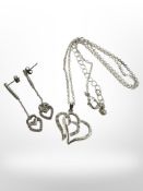 A chain with heart pendants and earrings