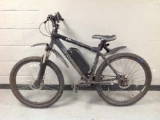 A Saracen Mantra electric off road bike, with battery pack,