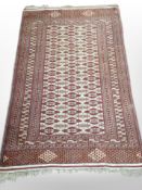 An Afghan rug of geometric design,