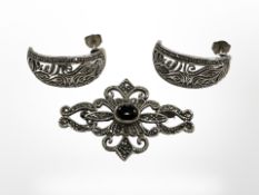 A pair of silver earrings and brooch