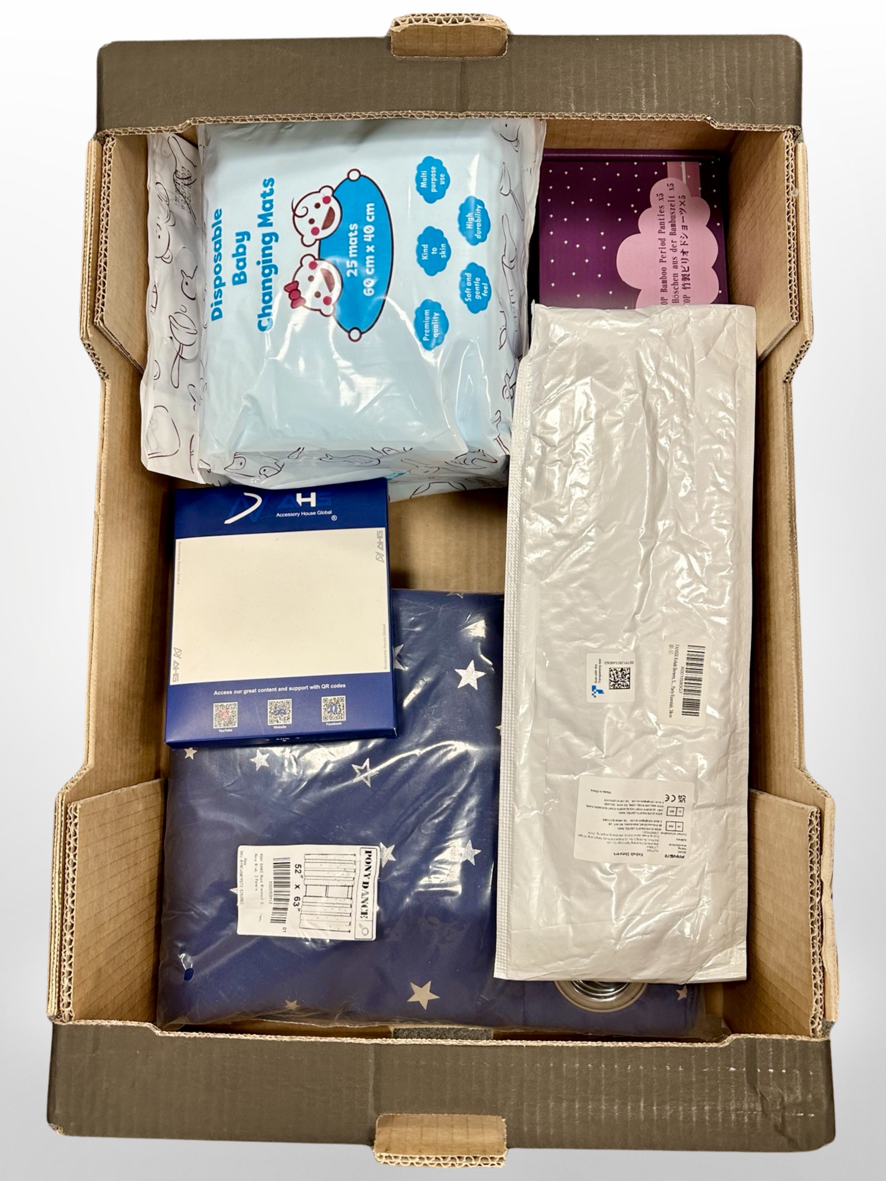 A box of new retail stock items - Keebab skewers, baby changing mats,