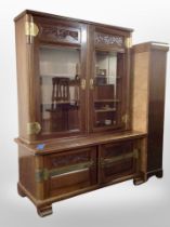 An early 20th century mahogany brass mounted bookcase on stand,