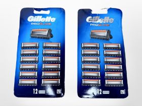 Two packs of Gillette Pro-Glide razor blades (12 per pack). (2)