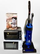 A Hoover upright vacuum cleaner, microwave,