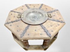 A 19th century Scandinavian pine octagonal low table, with central hammered metal twin handled bowl,