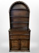 An oak linen fold dresser,