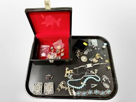 A jewellery box containing costume jewellery, bracelet, chains,