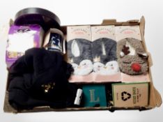 A box containing slippers, coasters, gloves, sweatshirt, other homewares.