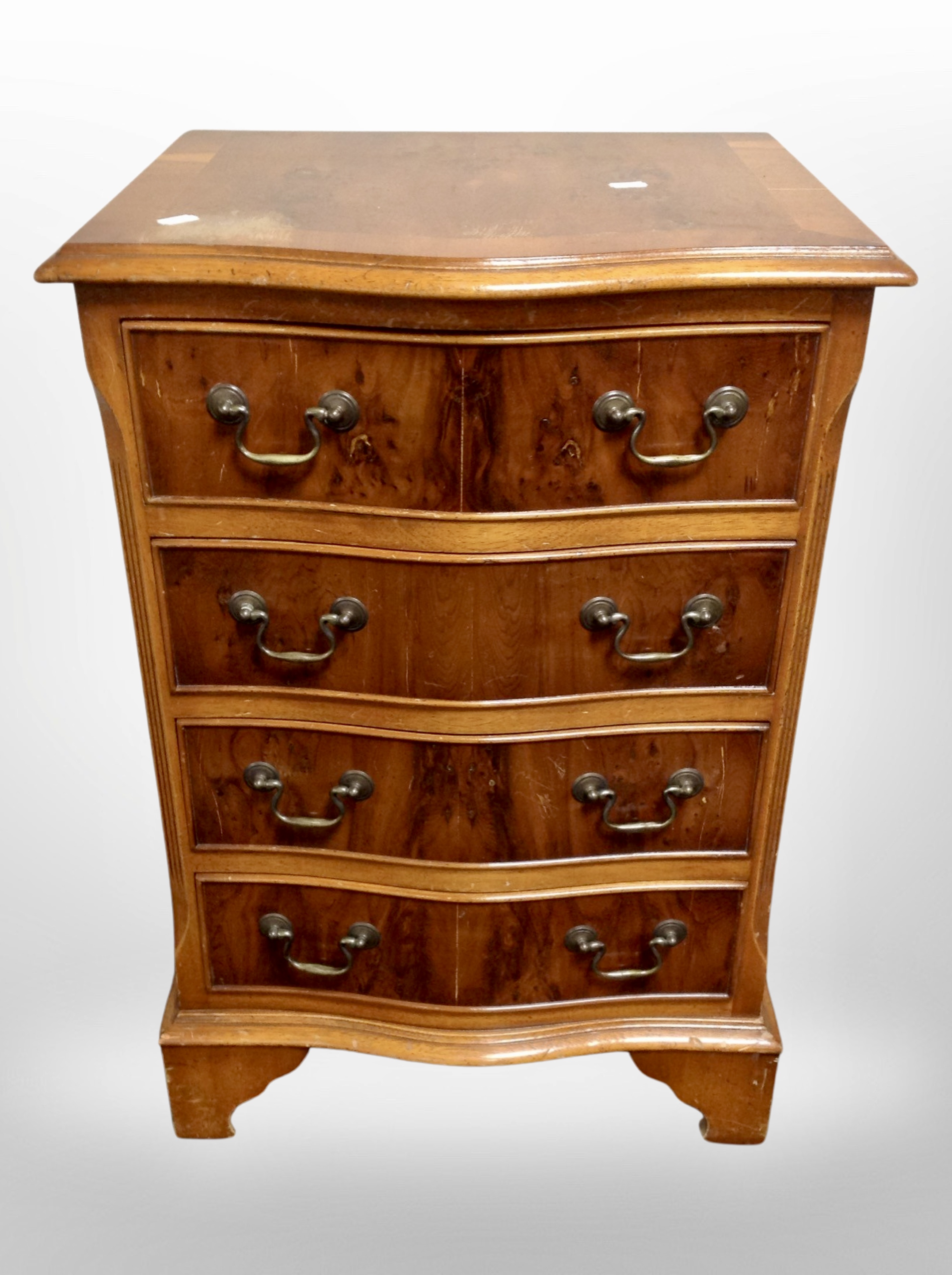 A reproduction yewood four drawer chest,