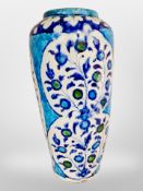 An Islamic-style tin-glazed terracotta vase, height 59cm.