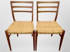 A pair of 20th century Danish teak ladder back chairs with cane seats