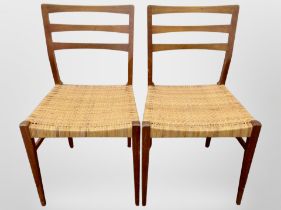 A pair of 20th century Danish teak ladder back chairs with cane seats