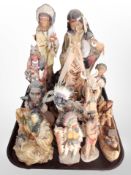 A group of diecast resin Native American figures.