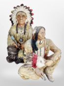 Two resin figures of seated Native Americans, tallest 49cm.