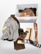 A crate of leather and suede cow boy attire including chaps,