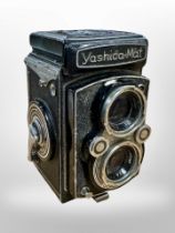A Yashica-Mat Copal camera numbered 57100180