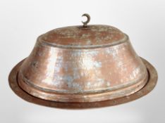 A 19th century Islamic copper-plated food dish with cover, length 45cm.