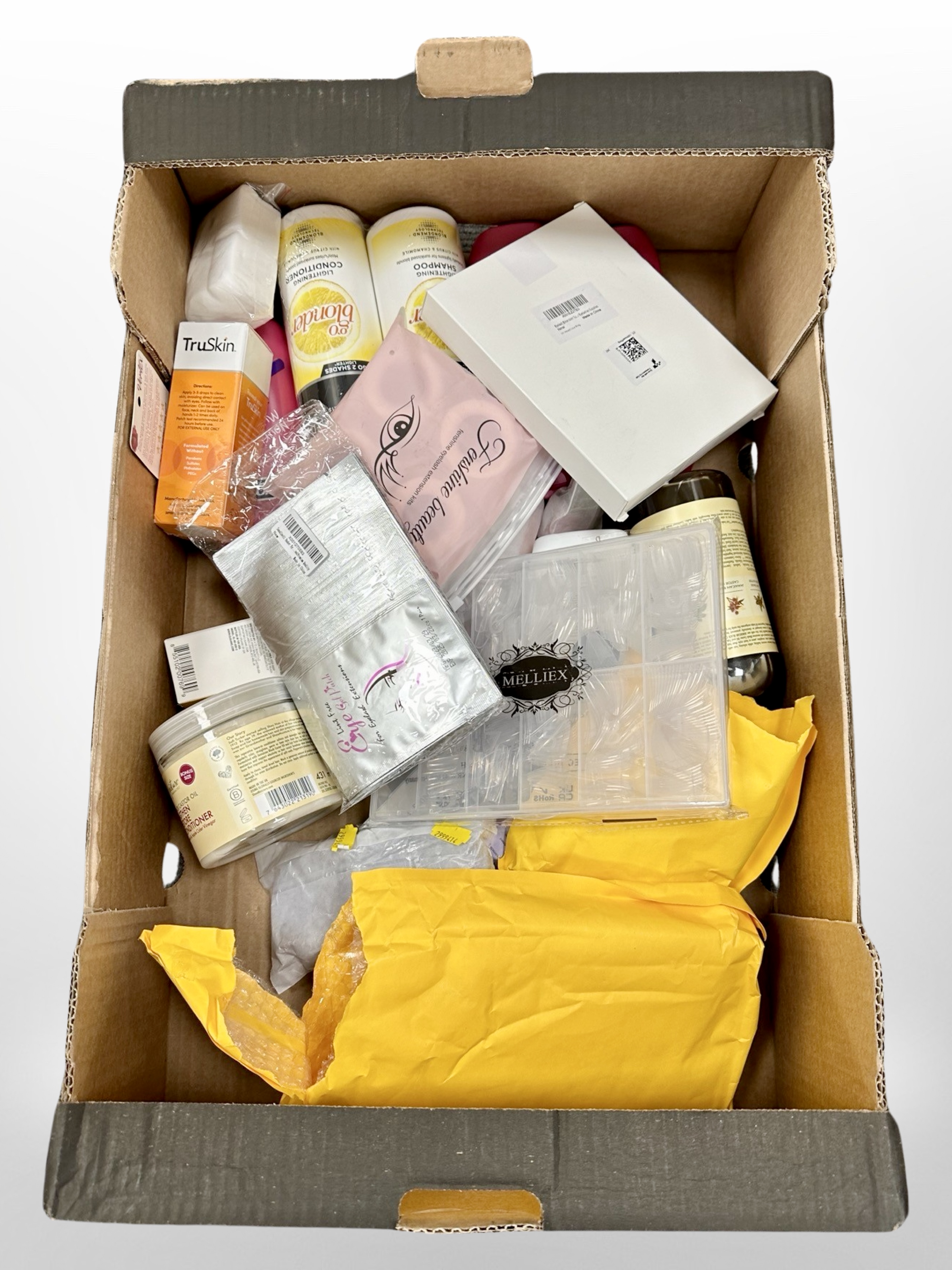 A box of new retail stock items - V05 shampoo, hair products,