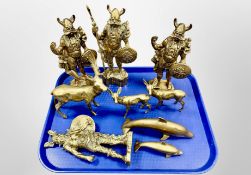 A group of heavy cast brass figures of Viking warriors,
