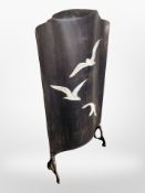 Two tin and cast iron fire screens painted with birds in flight,