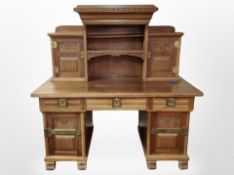 A 19th century continental mahogany twin pedestal writing desk with shelves and cupboard above,
