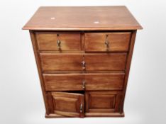 An Edwardian linen chest fitted cupboards and drawers,