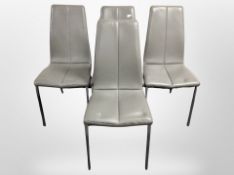 A set of four contemporary stitched grey leather dining chairs on chrome legs