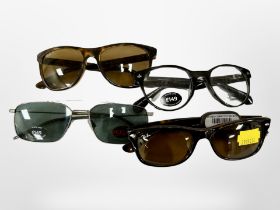 Four pairs of designer glasses - Ray-Ban (2), Vivienne Westwood and Hugo Boss.