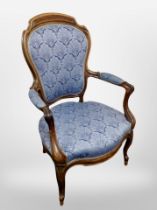 A Continental carved walnut salon armchair