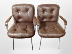 A pair of 20th century Scandinavian brown leather metal framed armchairs (af)