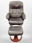 A late 20th century Danish brown leather swivel armchair and matching stool