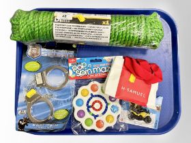 A length of polyprene rope (sealed), together with children's toys and an H Samuel child's bracelet.