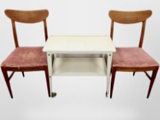 A pair of 20th century Danish teak framed chairs and a painted trolley