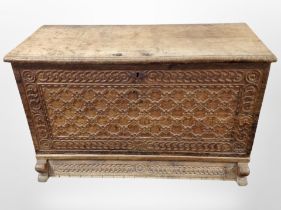 A 19th century Scandinavian carved oak fall front blanket chest with key,