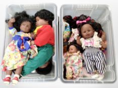 Two boxes of contemporary dolls.