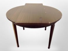 Two 20th century Scandinavian mahogany veneered circular dining tables