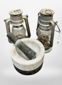 Two vintage tin miner's lamps together with a marble pestle and mortar.