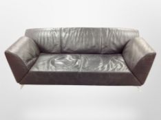 A late 20th century Danish black leather three seater settee on aluminium legs by Jori,