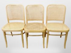 Three Scandinavian bentwood chairs with cane seats