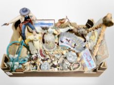 A box of Native American figures and other decorative objects, figure of a gunslinger.