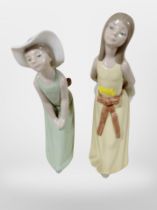Two Lladro figures of girls.