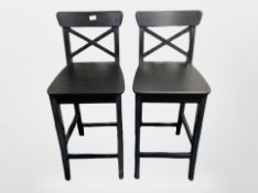 A pair of contemporary stained wooden high chairs