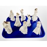 Eight Royal Doulton porcelain figurines including Christmas angel, loving you, Christmas carols,