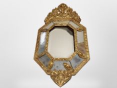 A Venetian-style gilt plaster cushion-framed sectional mirror, height 80cm.