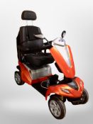 A Kymco electric mobility scooter with charging lead and key