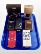 A group of men's fragrances including Dior Sauvage, Carolina Herrera 212, Tom Ford Black Orchid,