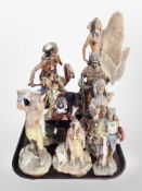 A group of diecast resin Native American figures.