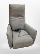 A contemporary electric reclining armchair