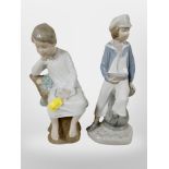 A Lladro figure of a boy dressed as a sailor, and a further boy sitting on a tree stump.